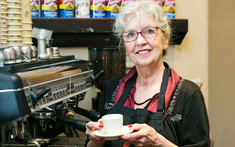 An archival photograph at the bakehouse coffee counter